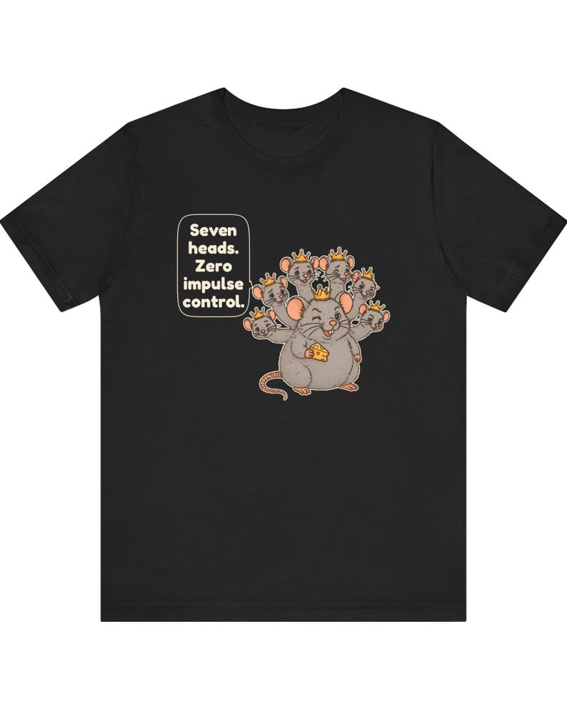 May include: A black short-sleeved t-shirt featuring a graphic of a gray seven-headed rat wearing small gold crowns. The rat holds a piece of yellow cheese. Text in a white speech bubble reads: Seven heads. Zero impulse control.