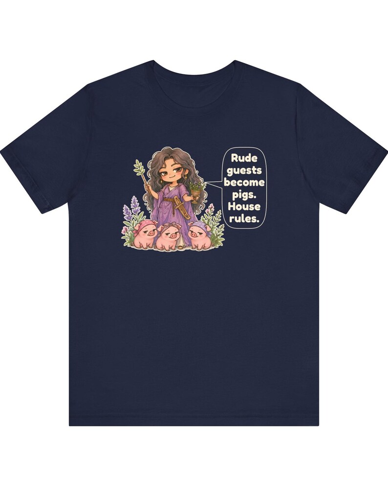 May include: A navy blue t-shirt featuring a graphic of a character in a purple dress holding a staff and a cup, surrounded by three small pigs. A speech bubble contains the text: Rude guests become pigs. House rules.