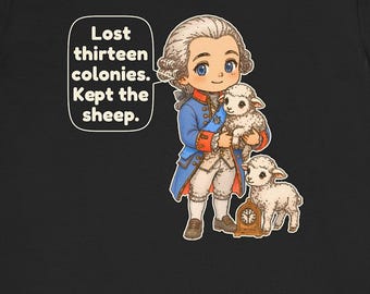 May include: A black t-shirt featuring a cartoon illustration of a historical figure in a blue coat and white breeches holding a white lamb, with another lamb and a small clock nearby. A speech bubble contains the text: Lost thirteen colonies. Kept the sheep.
