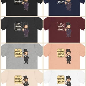 May include: A collection of eight short-sleeve t-shirts in various colors featuring a cartoon illustration of Abraham Lincoln in a top hat holding a pocket watch with a speech bubble that reads, This meeting is taking 4 score and 7 years.