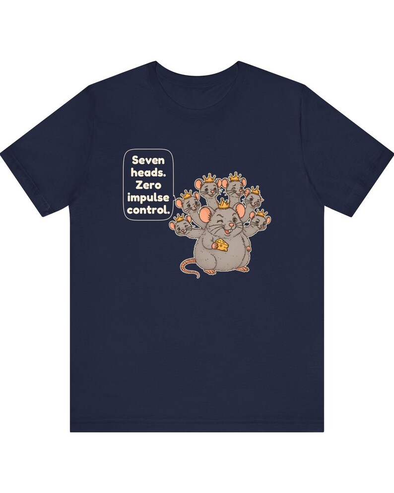 May include: A navy blue short-sleeve t-shirt featuring a graphic of a seven-headed mouse wearing small gold crowns and holding a piece of yellow cheese. The text "Seven heads. Zero impulse control." is printed in white next to the mouse.