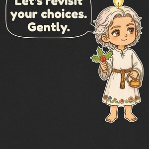 May include: A black t-shirt featuring a cartoon character with a candle flame on their head, holding holly and a small gold kettle. A speech bubble contains the text: Let's revisit your choices. Gently. The character wears a white tunic with floral embroidery.
