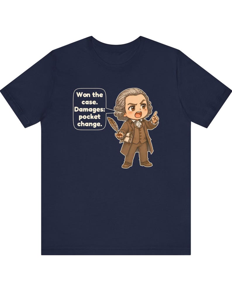 May include: A navy blue t-shirt featuring a cartoon illustration of a historical figure in a brown suit holding a quill. A speech bubble contains the text: Won the case. Damages: pocket change. The figure has brown hair and is pointing.