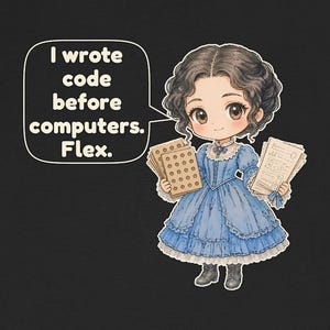 May include: A black t-shirt featuring a cartoon illustration of a person in a blue Victorian-style dress holding punch cards and papers. A speech bubble contains the text: I wrote code before computers. Flex.