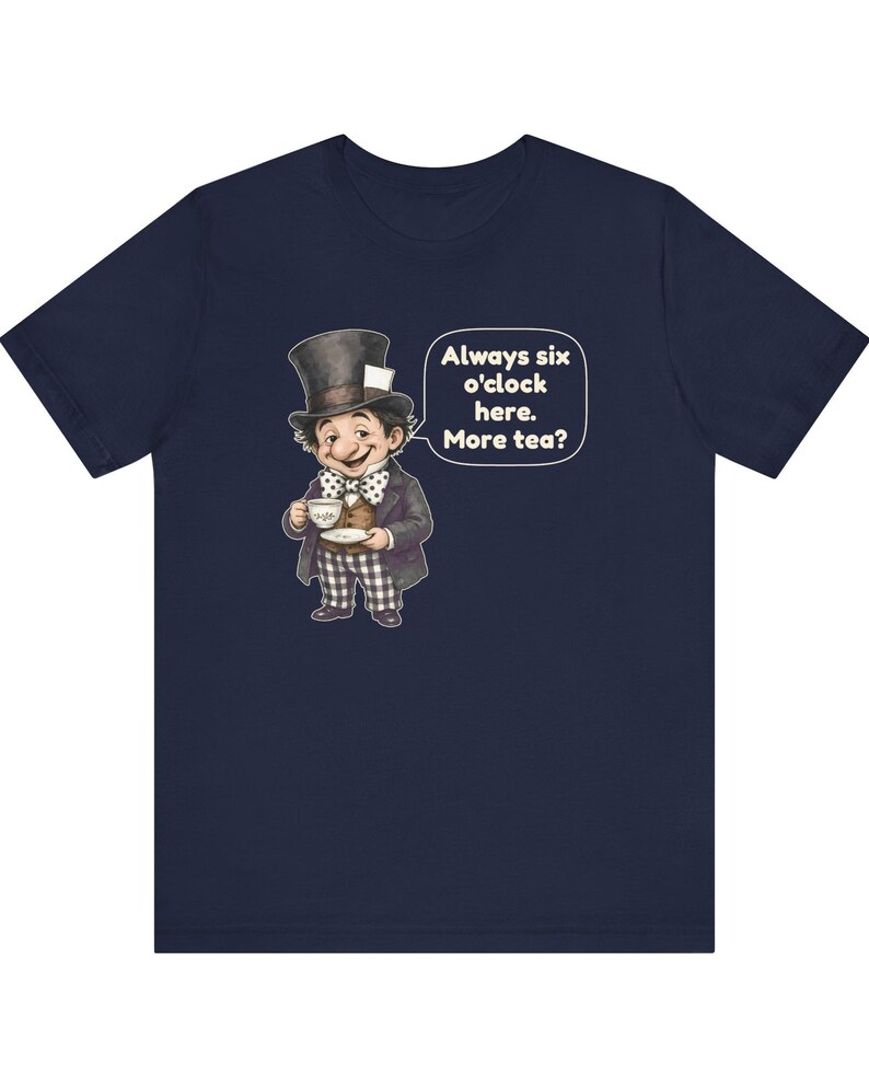 May include: A navy blue short-sleeve t-shirt featuring a graphic of a character in a top hat holding a teacup. A speech bubble next to the character contains the text: Always six o'clock here. More tea? The character wears a polka dot bow tie.