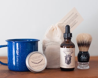 Shave kit with goat milk soap bar, brush, cup, grooming oil and nick salve
