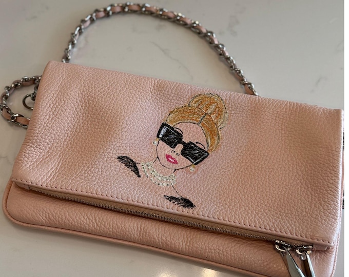 Pretty in Pearls is a soft pink cross body with a beautiful gold chain strap.