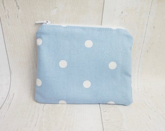 Coin purse/zipper pouch made with blue polka dot cotton fabric, fully lined with water proof fabric