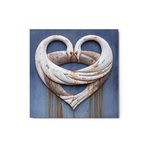 May include: A square metal wall art piece featuring two white swans with weathered paint and rust spots, their long necks curved to form a heart shape against a blue background with vertical brown rust streaks running downward.