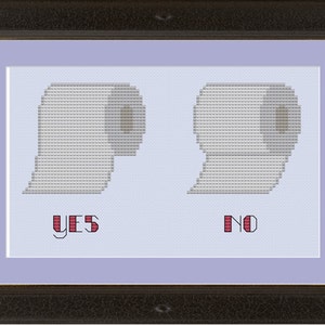May include: A framed cross-stitch design with two toilet paper rolls, one with the word "YES" underneath and the other with the word "NO" underneath.