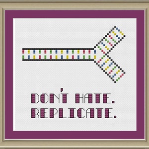 May include: A white cross-stitch embroidery with a colorful DNA strand design and the text "Don't hate. Replicate."