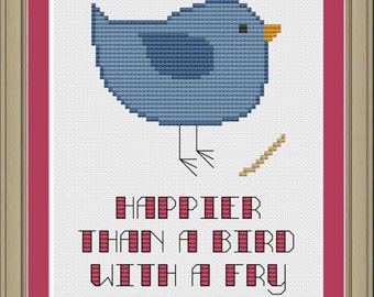 May include: Cross stitch pattern featuring a blue bird with a twig in its beak. The text "Happier than a bird with a fry" is below the bird.