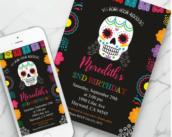 May include: A black invitation card and a smartphone displaying the same design, featuring a colorful sugar skull, vibrant floral accents, and festive bunting. The text reads: Meredith's 2ND BIRTHDAY, Saturday, September 29th at 3:00 pm, 1990 Lilac Ave, Hayward, CA 94545, Come dressed in your most vibrant attire, Please RSVP 510-331-5073.