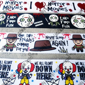 May include: Four different horror movie themed ribbon designs. The first ribbon is black with white text and a red heart that says "I love horror movies". The second ribbon is black with white text and a red heart that says "I love horror movies". The third ribbon is white with black text and a red heart that says "I love horror movies". The fourth ribbon is white with black text and a red heart that says "I love horror movies".