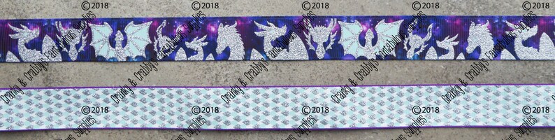 May include: Two different ribbon designs featuring a silver glitter dragon silhouette on a purple and blue galaxy print and a white and blue geometric pattern. The ribbon is 1.5 inches wide.