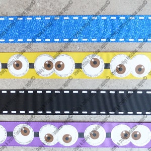 Pode incluir: Fitas em azul ganga, amarelo com olhos de desenho animado, preto com costuras brancas e roxo com olhos de desenho animado. Ideais para artesanato e para adicionar um toque decorativo.