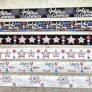 May include: Ribbons with patriotic designs. The ribbons feature text that reads "God Bless America", "Land of Liberty", and "Hero the Free". The ribbons are in red, white, and blue colors, with star and burst patterns.