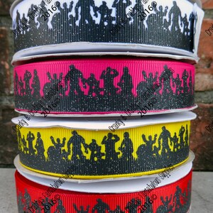 May include: Four rolls of black and white glitter ribbon with a silhouette design of people. The ribbon is available in white, pink, yellow, and red.