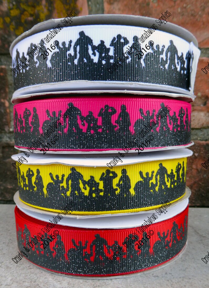 May include: Four rolls of black and white glitter ribbon with a silhouette design of people. The ribbon is available in white, pink, yellow, and red.
