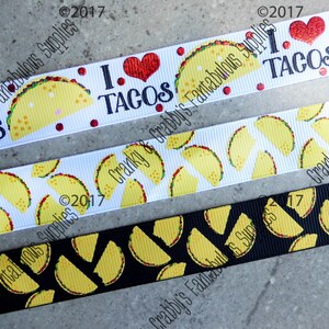 May include: Three different ribbon designs featuring a yellow taco pattern. The top ribbon is white with red hearts and the text "I love tacos". The middle ribbon is white with yellow tacos. The bottom ribbon is black with yellow tacos.