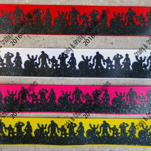May include: Four different colored ribbon trims with a black silhouette of a band playing music. The ribbon trims are red, white, pink, and yellow. The text "Cranky & Crabby's 2016" is on the red and white ribbon trims.
