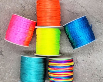 May include: Six spools of colourful waxed cord, including neon pink, neon yellow, orange, teal, blue and rainbow.