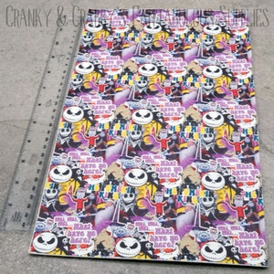 May include: A purple, yellow, and black patterned fabric with a repeating image of Jack Skellington from the Nightmare Before Christmas movie. The fabric has the text "What have we here?" repeated throughout.