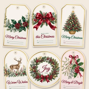 May include: Six rectangular and circular gift tags with gold-look borders featuring watercolor botanical illustrations of holly, a red bow, a Christmas tree, a deer, a wreath, and mistletoe with text including Merry Christmas and Joy.