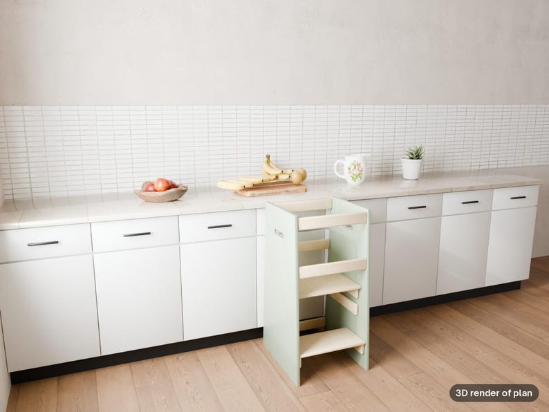 May include: A light green wooden learning tower with a multi-level step design, positioned in front of white kitchen cabinets with black handles, a white tiled backsplash, and a light wood floor. The text 3D render of plan is visible.