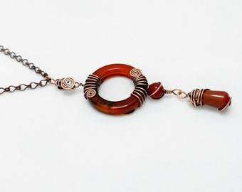 Handcrafted pendant: copper wire wrapped, patinated / oxidized, with red Agate & Carnelian gemstones. One-of-a-kind, handmade. Gift idea.