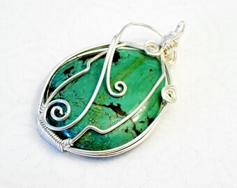 Handcrafted pendant: wire wrapped, genuine Turquoise gemstone cabochon, silver plated copper wire. Unique, handmade. Gift idea. Birthstone.