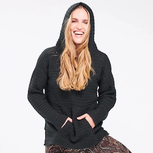 May include: A black long-sleeved hooded sweater featuring a textured knit pattern, a front kangaroo pocket, and ribbed cuffs. The garment has a relaxed fit with a hood that rests over the head, providing a consistent dark color throughout.