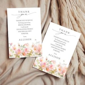 May include: Two white thank you cards with floral watercolor design. The cards have the text "Thank You" in script and a message of gratitude for a bridal shower, signed "Allison."