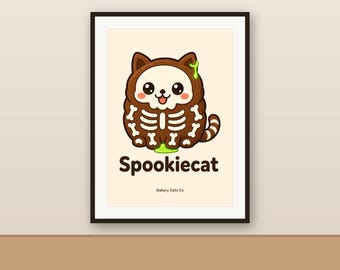 Op de afbeelding: Een ingelijste kunstdruk met een bruine cartoonkat in een wit skeletkostuum met groene slijmaccenten. De tekst Spookiecat staat in donkerbruin onder de kat gedrukt, met de kleinere tekst Bakery Cats Co aan de onderkant.