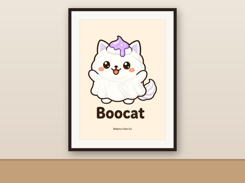 May include: A framed wall art print featuring a white cartoon cat dressed as a ghost with a purple dollop of frosting on its head. The text Boocat is printed in dark brown below the cat, with the smaller text Bakery Cats Co underneath.
