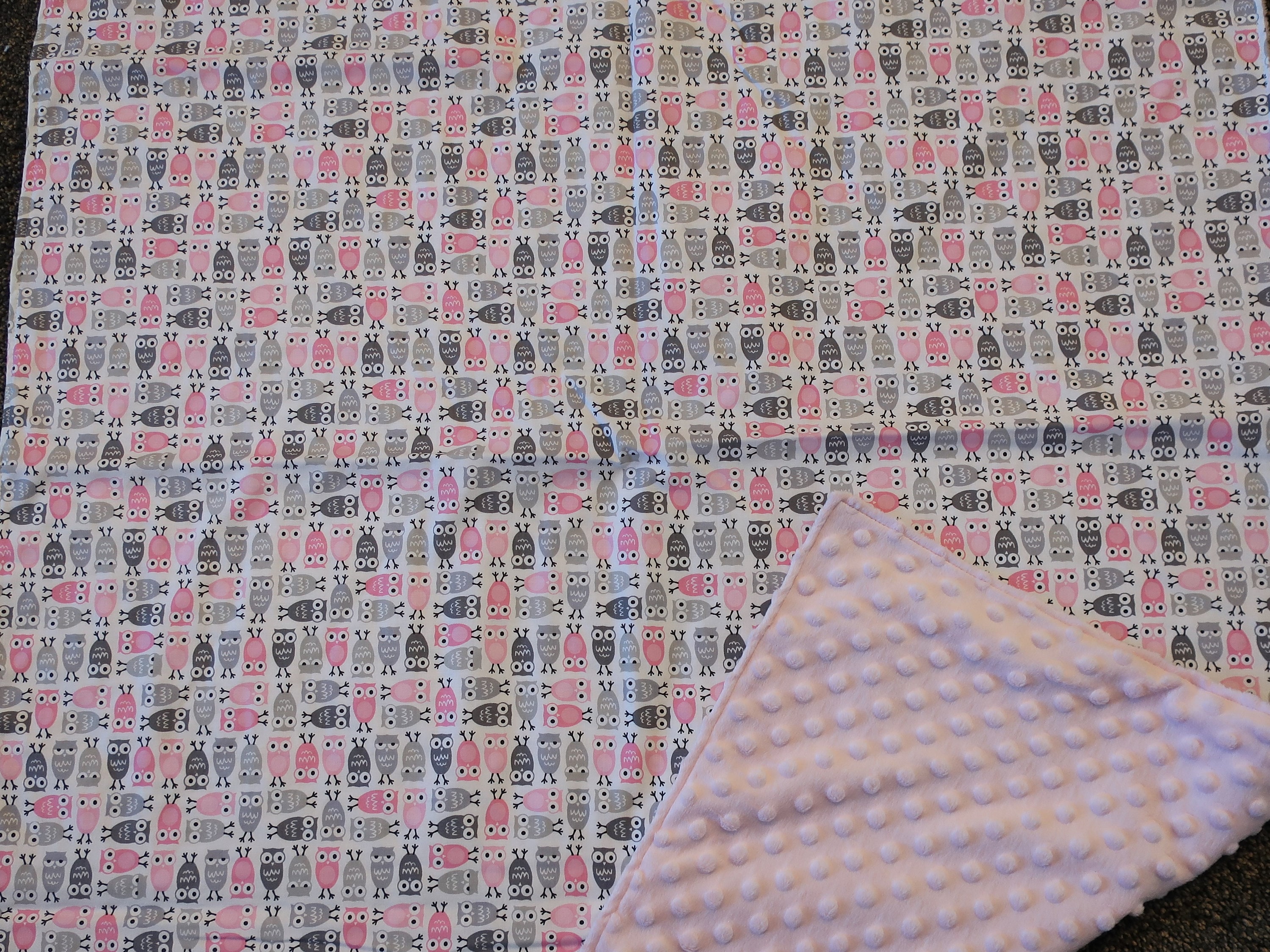Owl baby blanket with pink and gray owls on white background with pink minky backing