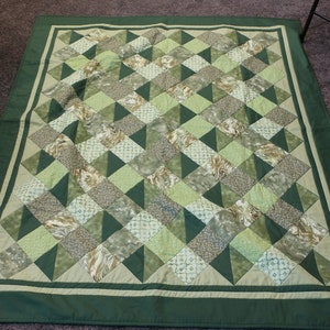 Quilt: Multi green with dark green border and backing