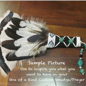 May include: A black and white feather fan with turquoise and white beads. The fan handle is wrapped in black leather with white stitching and turquoise accents. The text "Sample Picture" is written on a white background below the fan. The text "Use to inspire you what you want to have in your One of a Kind Custom Smudge/Prayer" is written below the first line of text.