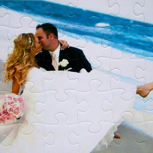 Personalized puzzle gift
of a bride and groom kissing on beach.  This photo puzzle is a gift for the best couples gift that is personalized.