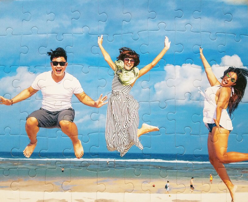 Puzzle from your picture of a family on a beach jumping on the sand.  The personalized puzzle is cheap but made well and features 60 pieces.