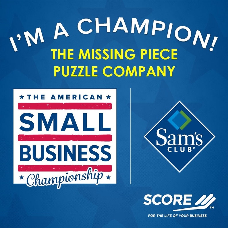 May include: A blue background with the text "I'm a Champion!" and "The Missing Piece Puzzle Company". Below the text are two logos: "The American Small Business Championship" and "Sam's Club". Below the Sam's Club logo is the text "SCORE" and "For the life of your business."