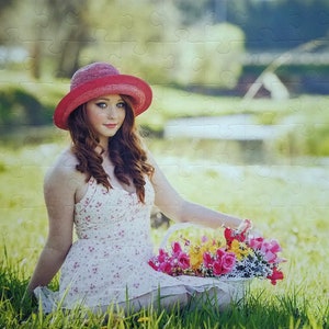 Custom puzzle of teen girl holding a basket of flowers.  Personalized puzzle of woman wearing hat and holding colorful flowers.