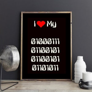 May include: Black and white print with a red heart and the text "I love My" followed by a series of binary code numbers: 01000111, 01100101, 01100101, 01110101.