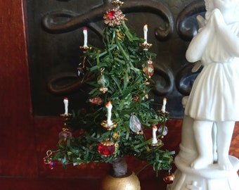Miniature dollhouse Christmas tree .Handcrafted and one of a kind .5 inches tall .Decorated with crystals .