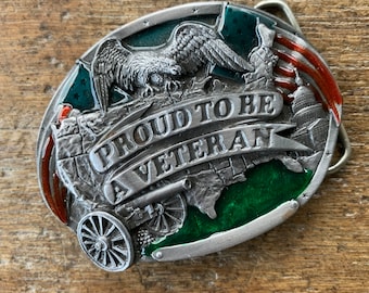 American Proud to be a Veteran eagle  canon and Capitol figural Belt Buckle Pewter enameled colored raised design 1983 Bergamot