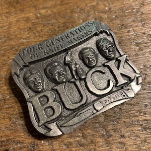 Vintage belt buckle Buck Knife Advertising Four Generations of Knife Makers Pewter colored belt buckle