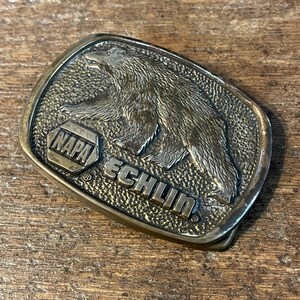Vintage NAPA Echilin National Automotive Parts Association Advertising Bear design Solid Brass belt buckle USA