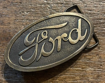 Vintage Ford Automotive oval brass colored belt buckle