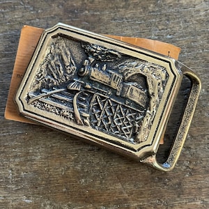 Vintage Buckle TE Express Railroad locomotive in mountains solid brass belt buckle Tech ether Guild Inc 1975