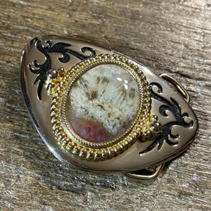 Vintage red and tan stone cabochon gold and silver colored belt buckle